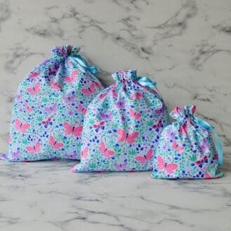 3 pink and purple butterfly fabric gift bags. Available in 3 sizes - large, medium and small