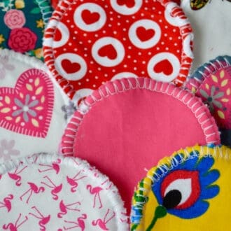 Selection of reusable makeup remove wipes. Red white hearts, plain red, pink flamingoes, plain pink, floral