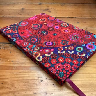 A5 handmade notebook covered in Kaffe Fasset fabric filled with plain paper