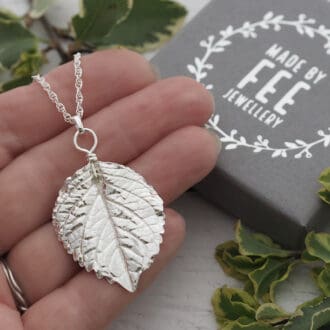 Intricately detailed Fine silver real hydrangea leaf pendant necklace on a sterling silver rope chain