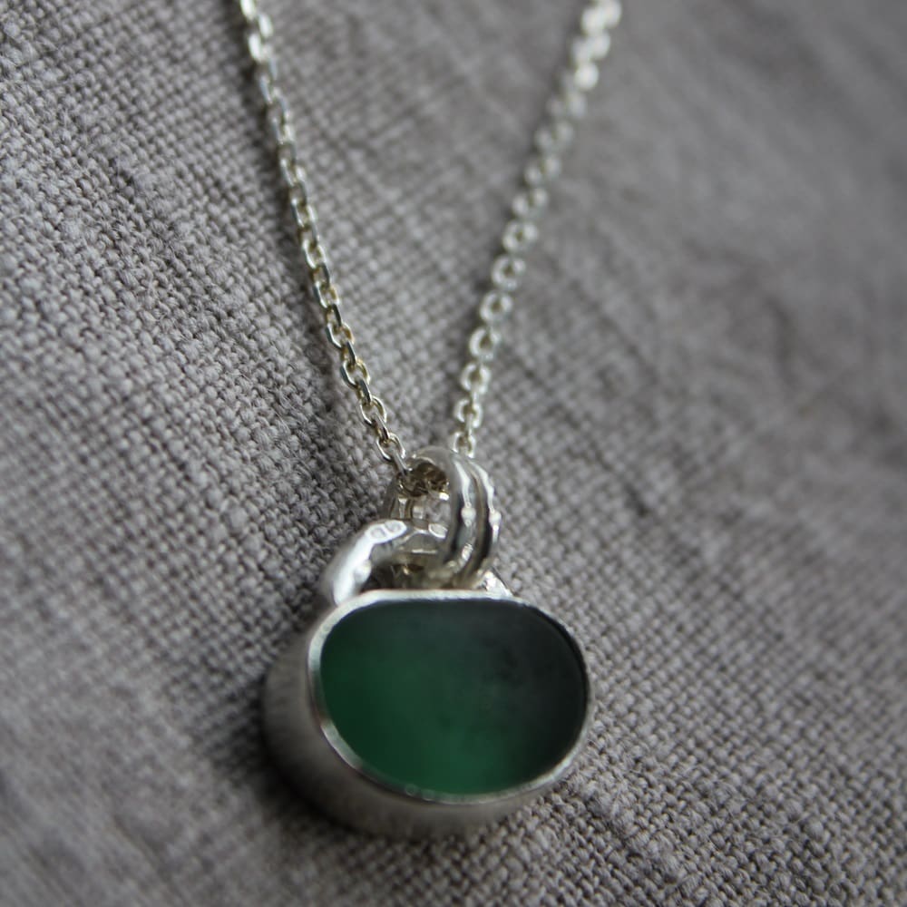 Deep green seaglass jellybean pendant in sterling silver