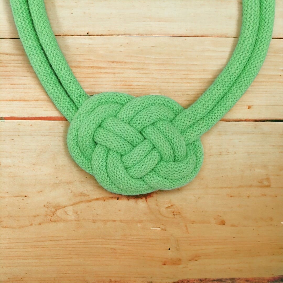 Close up of central knot feature on statement chunky rope necklace