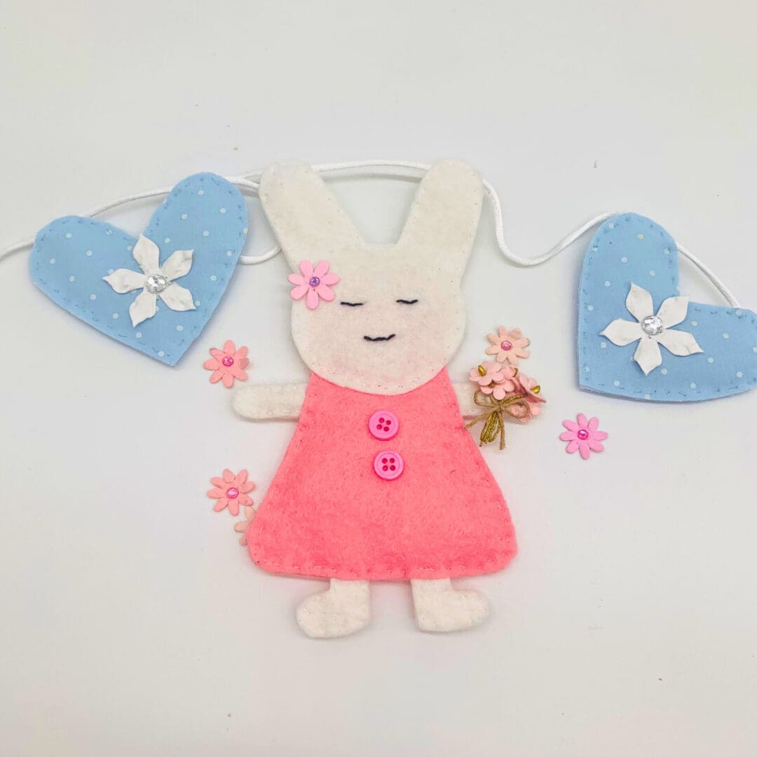 Bunny rabbits holding flowers Bunting