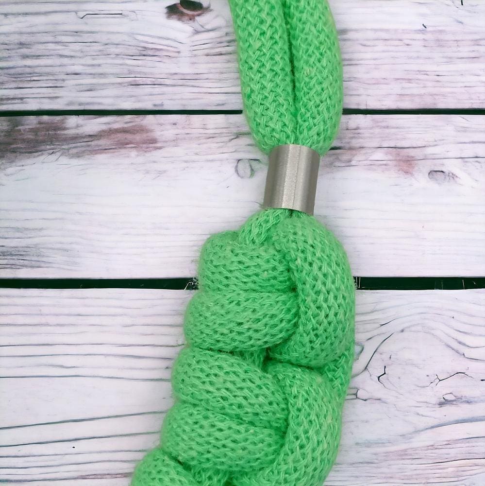 close up of knot detail on chunky statement knotted rope green necklace.