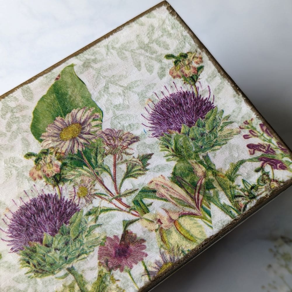 Wooden jewellery or keepsake box, decoupaged with a thistle design on the top and finished with gold leaf around the edge.