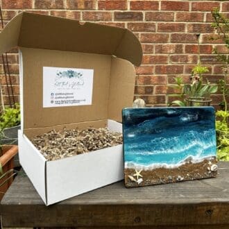 Cardboard box containing everything needed to create 3 resin seascapes