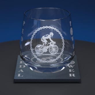 Cycling engraved whiskey tumbler glass together with matching slate coaster