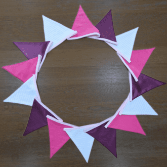 Long 5m length of bunting in pink, purple and white.