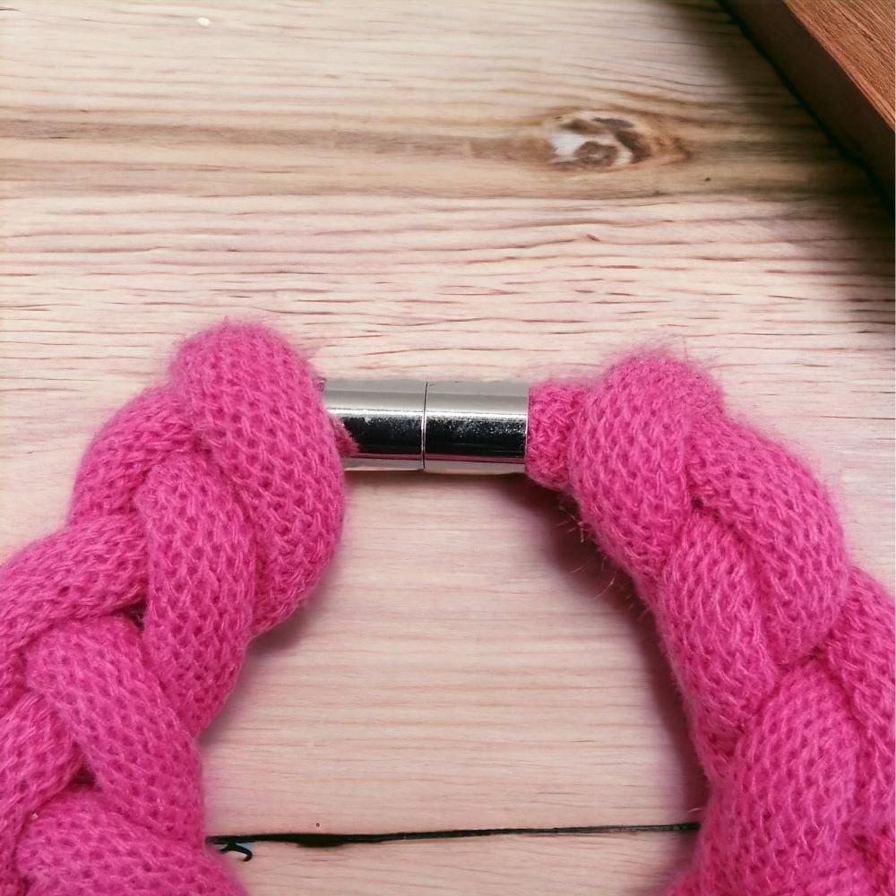 close up of magnetic clasp on chunky pink rope statement bracelet.
