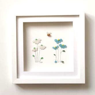 forget me nots and daisies made from tiny nuggets of Cornish sea glass set inside a 29cm frame
