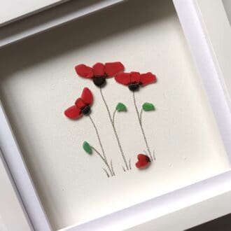 framed picture of three red poppies made from tiny nuggets of Cornish sea glass