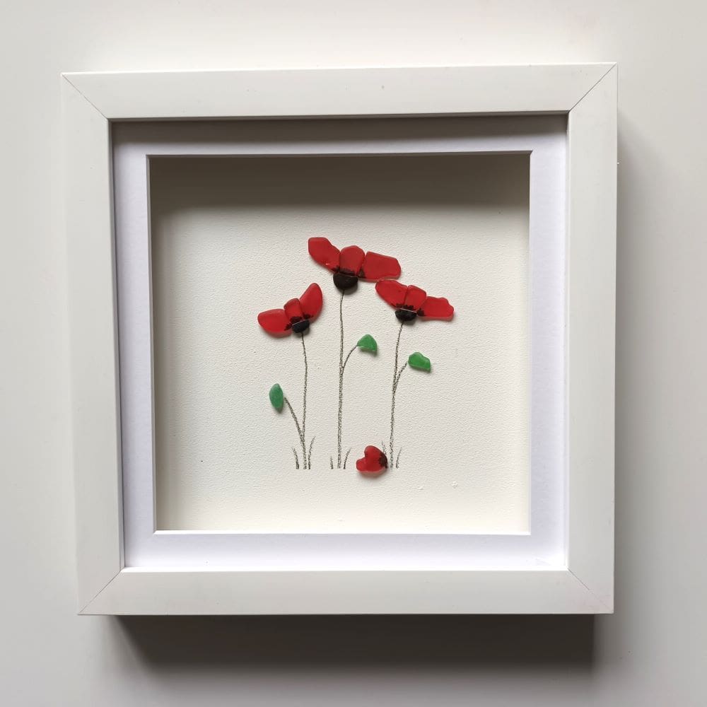 three red poppies made from Cornish sea glass set in a 24cm frame