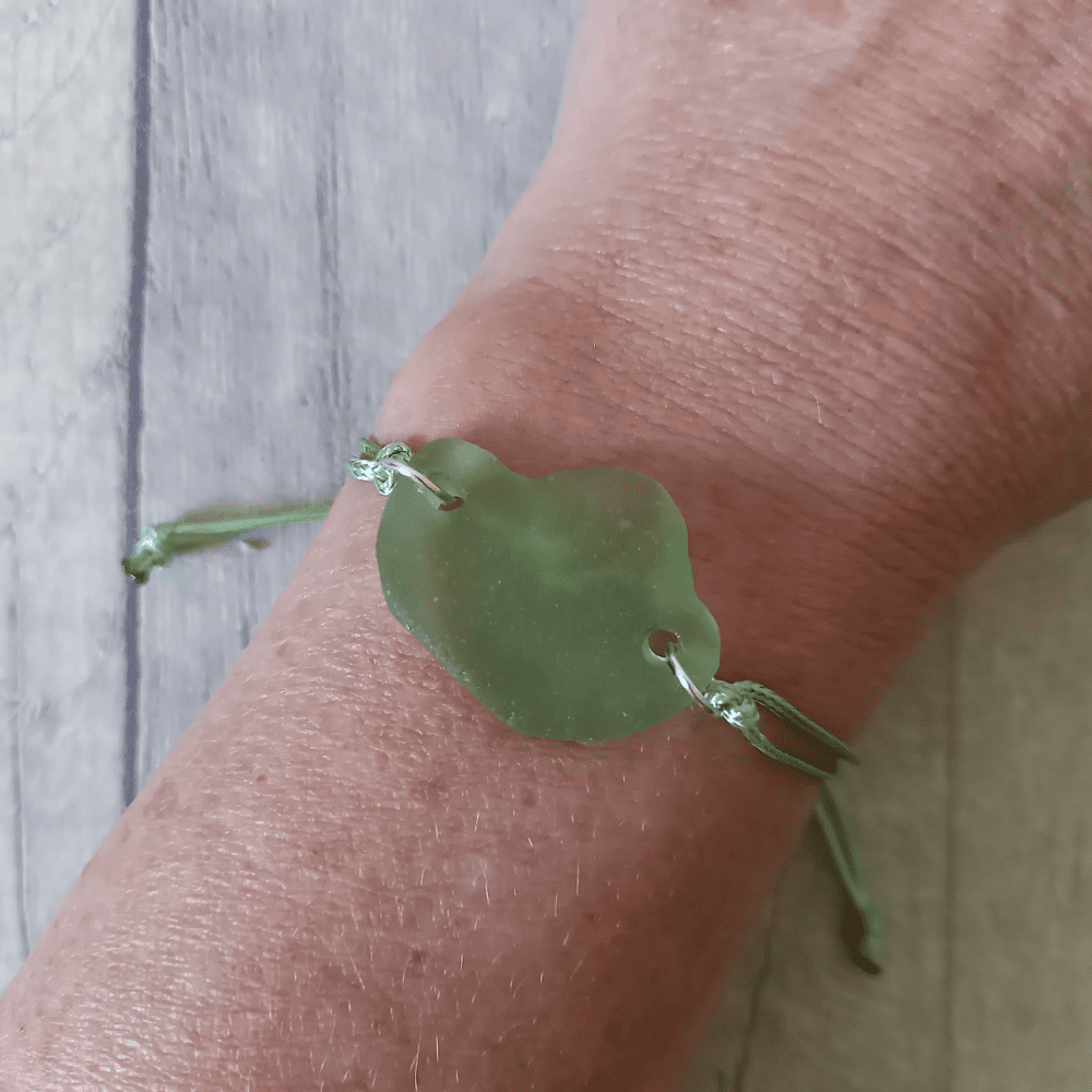 green seaglass bracelet worn on model's wrist
