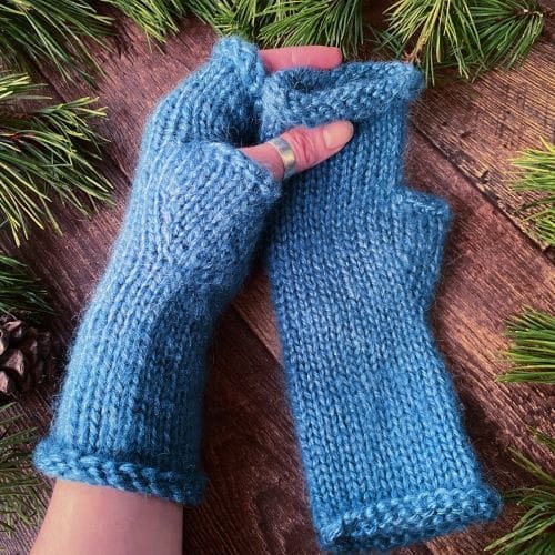 Soft blue knitted long arm warmers in fluffy mohair yarn