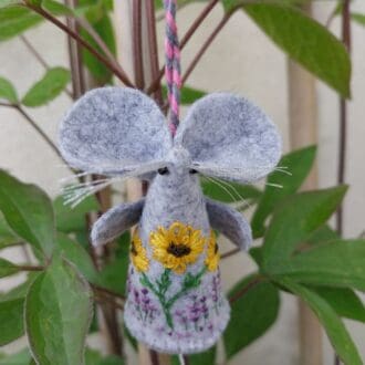 a handmade felt mouse, hand embroidered with a design of 2 Sunflowers above a field of lavender