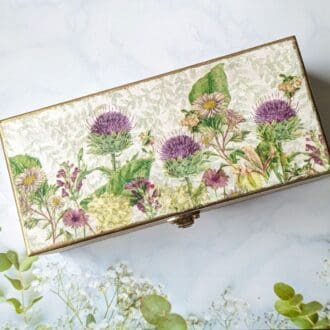 Wooden jewellery or keepsake box, decoupaged with a thistle design on the top and finished with gold leaf around the edge.