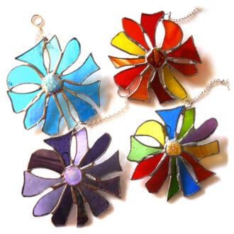 Abstract dichroic flower stained glass suncatcher tropical red purple sea colours turquoise