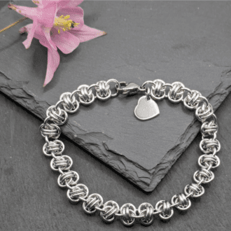 Chainmaille bracelet made with silver coloured rings woven in the barrel weave