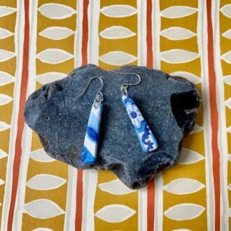 Blue & white patterned rectangle drop earrings. The pattern is mismatched to add a quirky vibe.