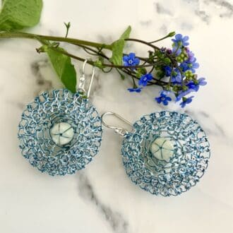 Bluebell earrings in mother of pearl and blue lace wirework