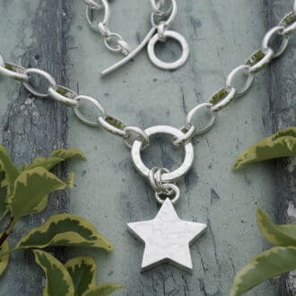 Solid silver 19mm wide 3mm deep hammered star necklace on 15mm circle connector with large linked silver belcher chain
