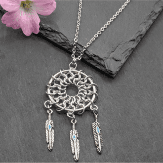 Chainamille pendant made in the shape of a dreamcatcher using aluminium rings and small feather charms on a 30 inch stainless steel chain