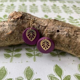 Elegant Purple Drop Earrings with a Gold Leaf Charm.