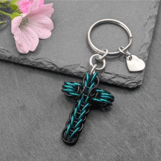 A chainmaille keyring made from the full persian weave in black and seagreen rings
