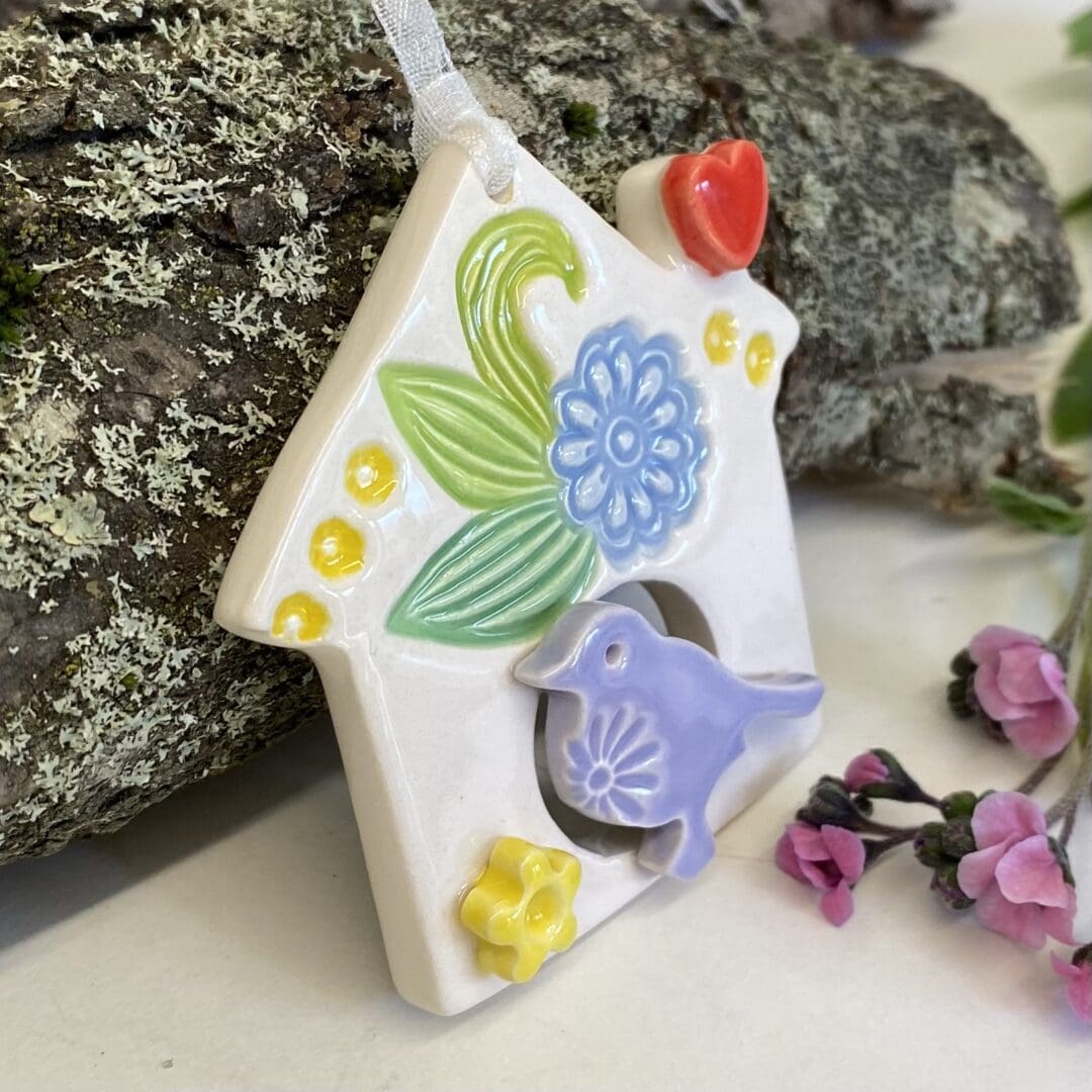 Pottery birdhouse decoration side view