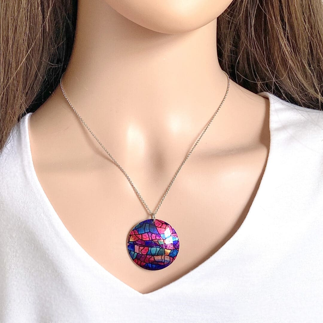 Handmade jewellery, pendant, necklace, round, disc, modern, abstract, pink, blue purple, stained glass design, unique gift, lightweight, aluminium, made in UK