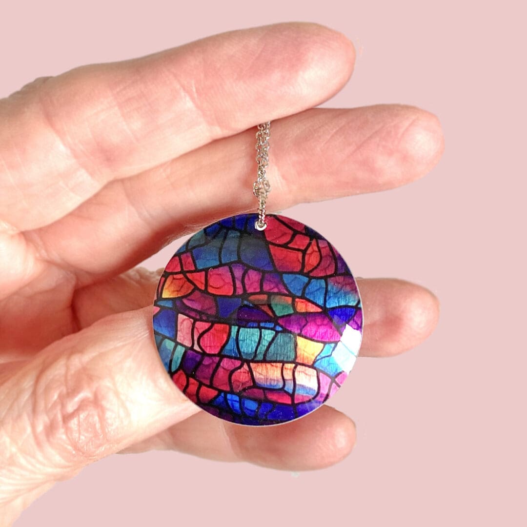 Handmade jewellery, pendant, necklace, round, disc, modern, abstract, pink, blue purple, stained glass design, unique gift, lightweight, aluminium, made in UK