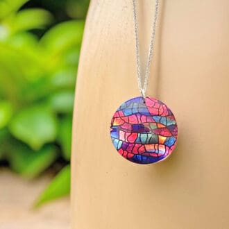 Handmade jewellery, pendant, necklace, round, disc, modern, abstract, pink, blue purple, stained glass design, unique gift, lightweight, aluminium, made in UK