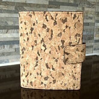 Passport holder in natural cork with zipped pocket, 4 card slots, 2 cash slots, secured with a magnetic snap
