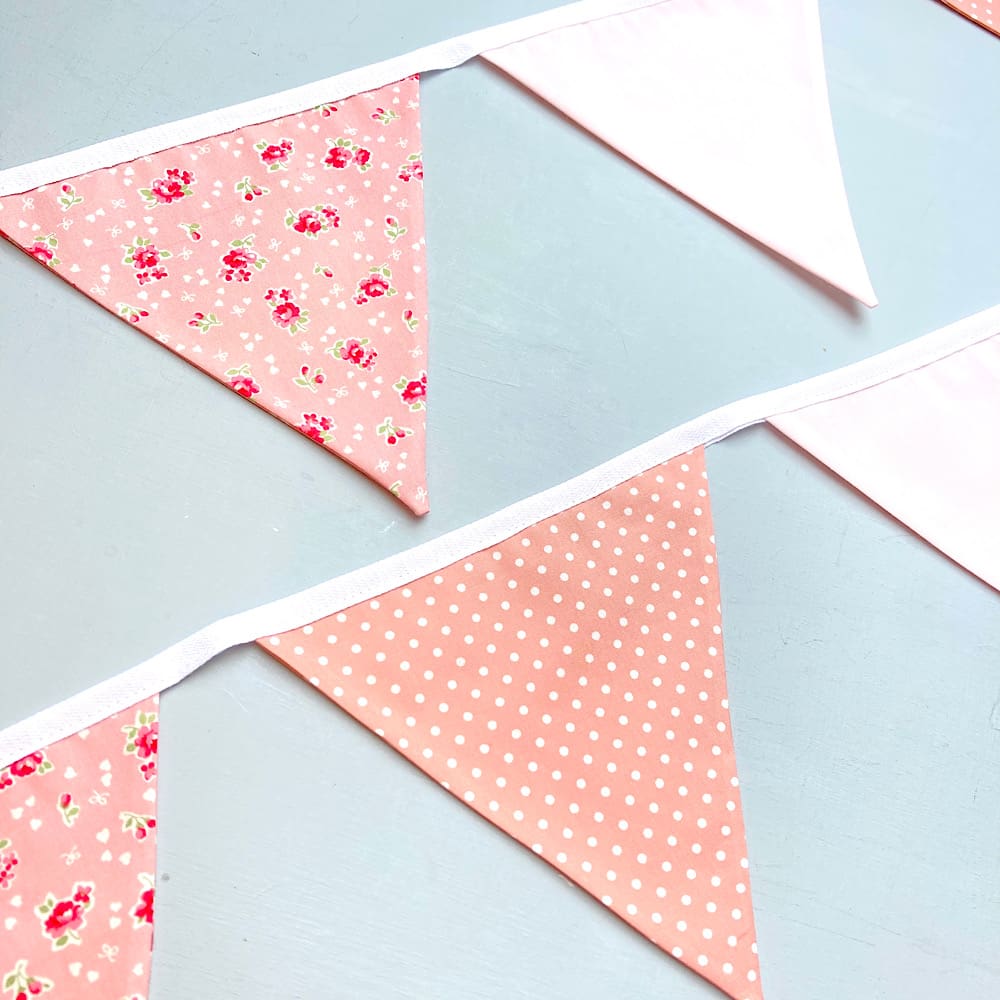 Pink Floral Bunting hung on wall