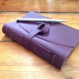 Small A6 Plum Coloured Faux Leather Wrap Journal filled with good quality plain white recycled paper