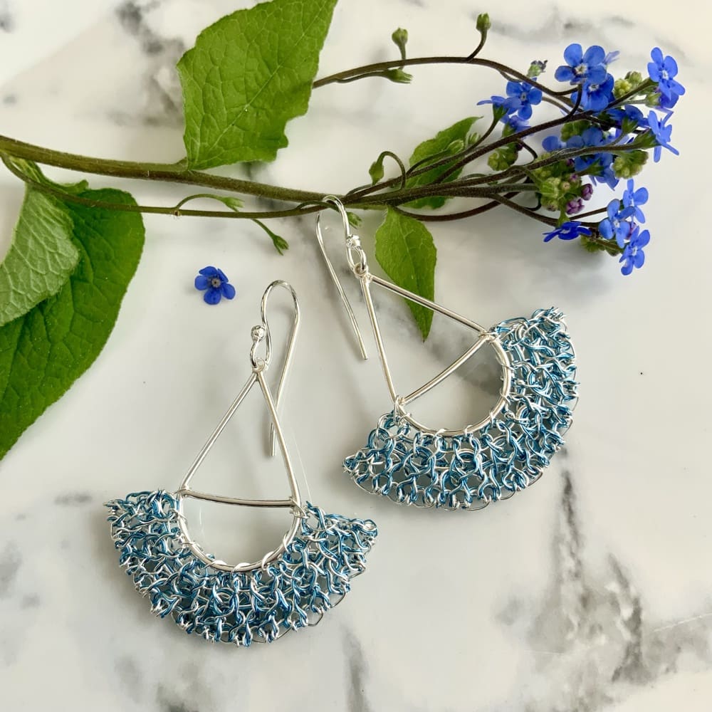 Silver fan shape drop earrings with pale blue wire work