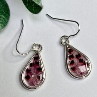 Silver teardrop earrings with pressed heather flower