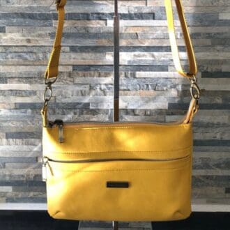 Crossbody Bag in mustard yellow vegan leather with a full width concealed front zip pocket and mustard webbing strap - both adjustable and removable.