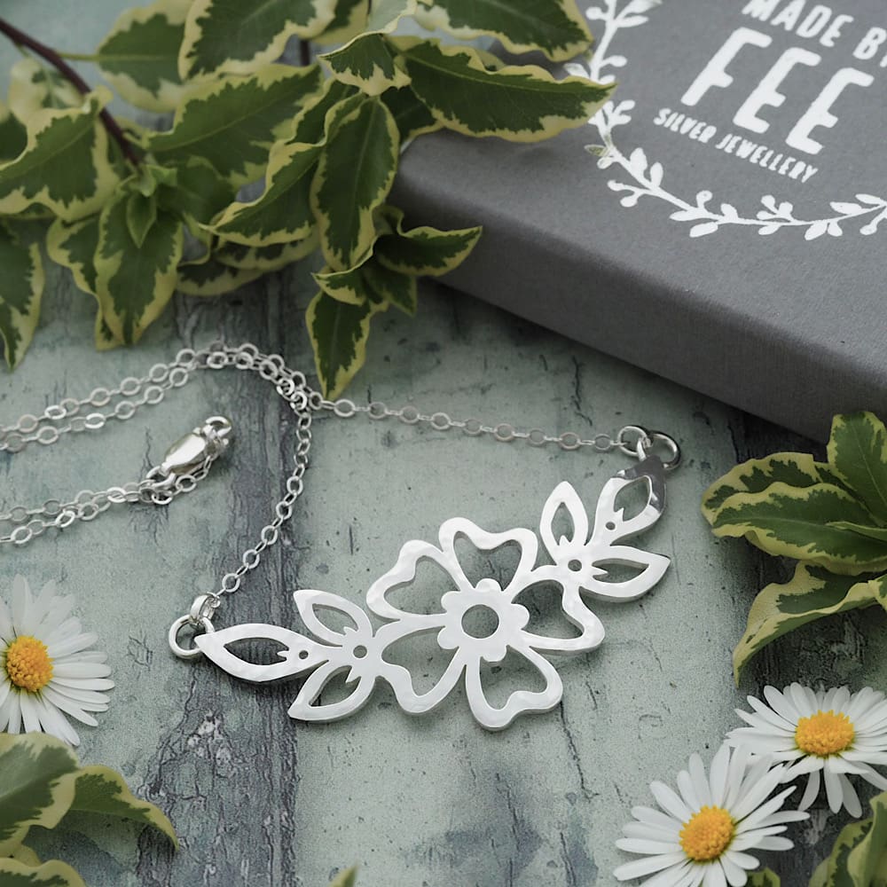 Handmade hammered Cutwork Sterling silver flower and leaf motif pendant on a delicate flat trace chain