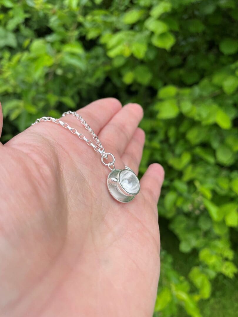 Silver coffee/tea cup and saucer pendant necklace