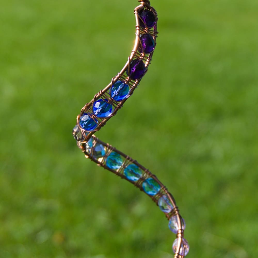 Copper wind spinner in blue, purple, aqua and lilac