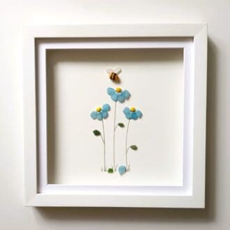 framed picture of forget me nots made from nuggets of cornish sea glass