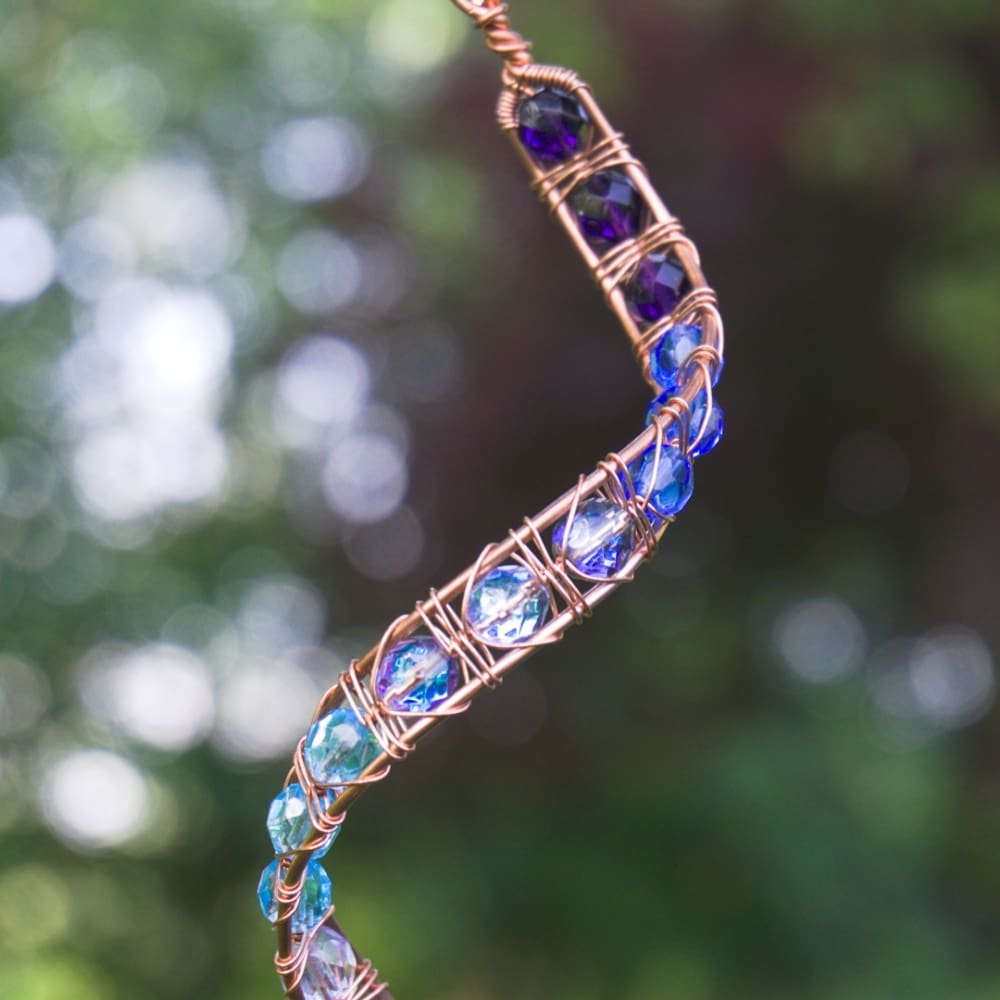 handmade garden mobile with blue and purple beads