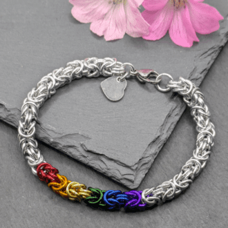 Chainmaille bracelet made in the byzantine weave. Made with silver and rainbow coloured aluninium rings