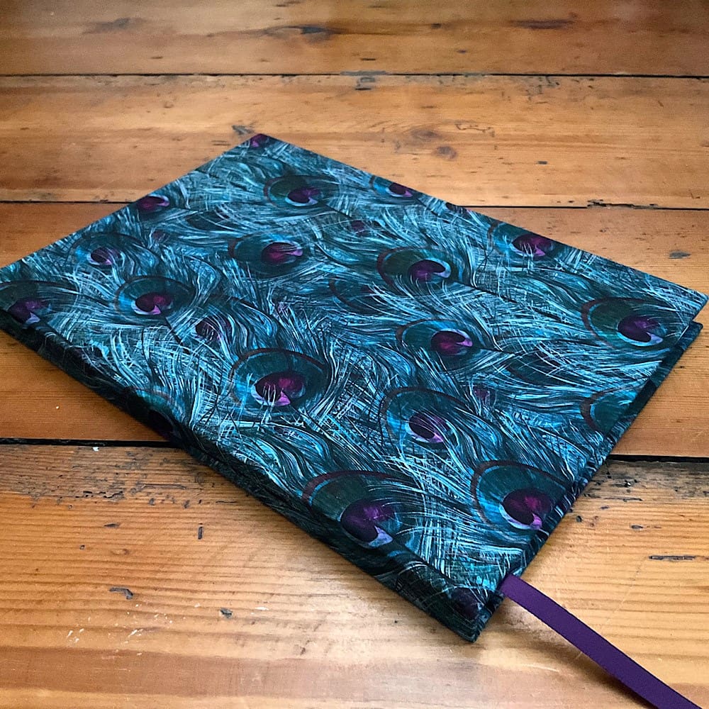 A5 Handmade Notebook with plain paper covered in Peacock Feather cotton fabric