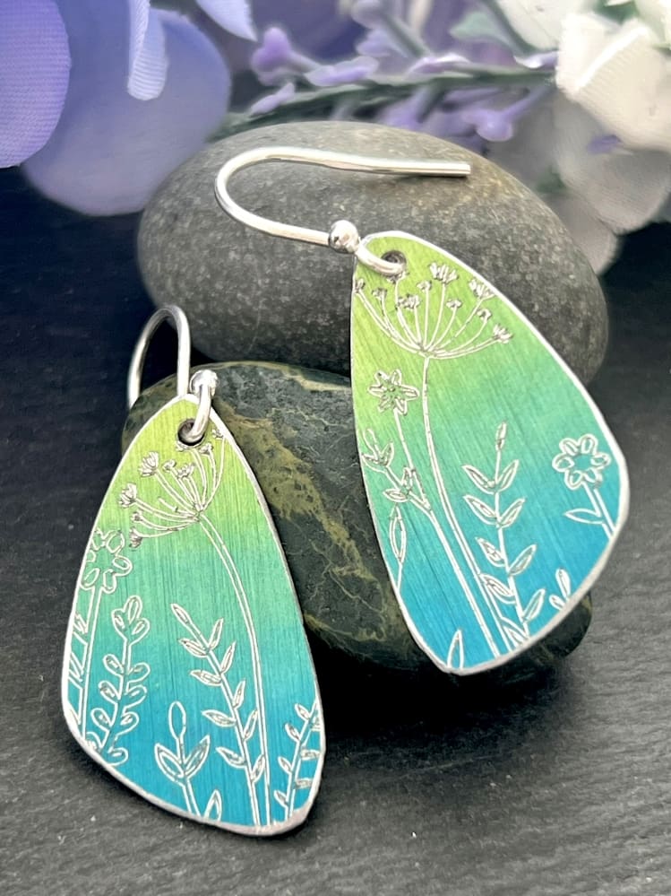 green and blue engraved earrings