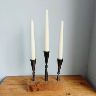Candle holder, 3 hand forged cones set into a piece of oak.