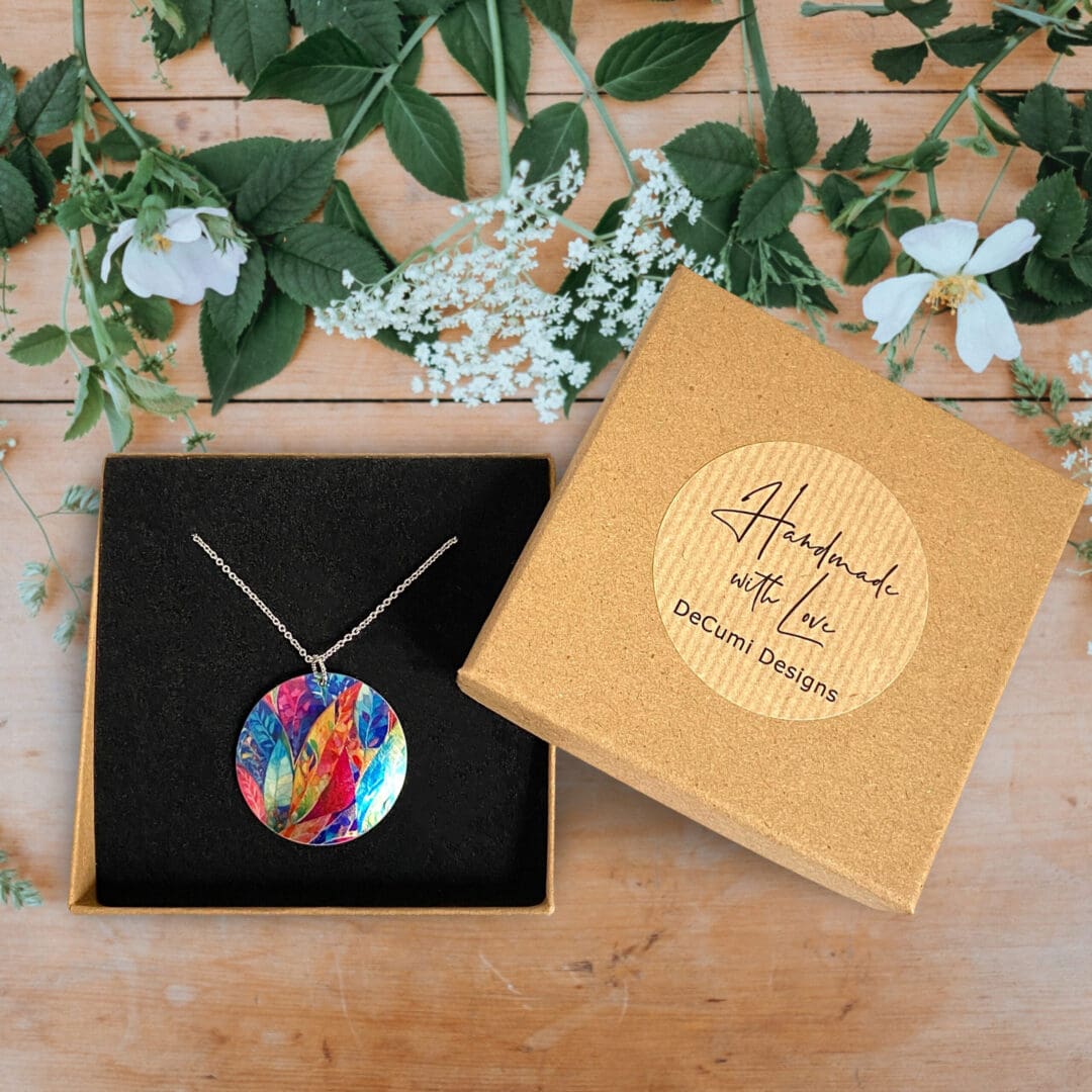 Necklace, pendant, jewellery, round, disc, metal, aluminium, multi-coloured, rainbow, leaf, nature, handmade, recycled, made in uk