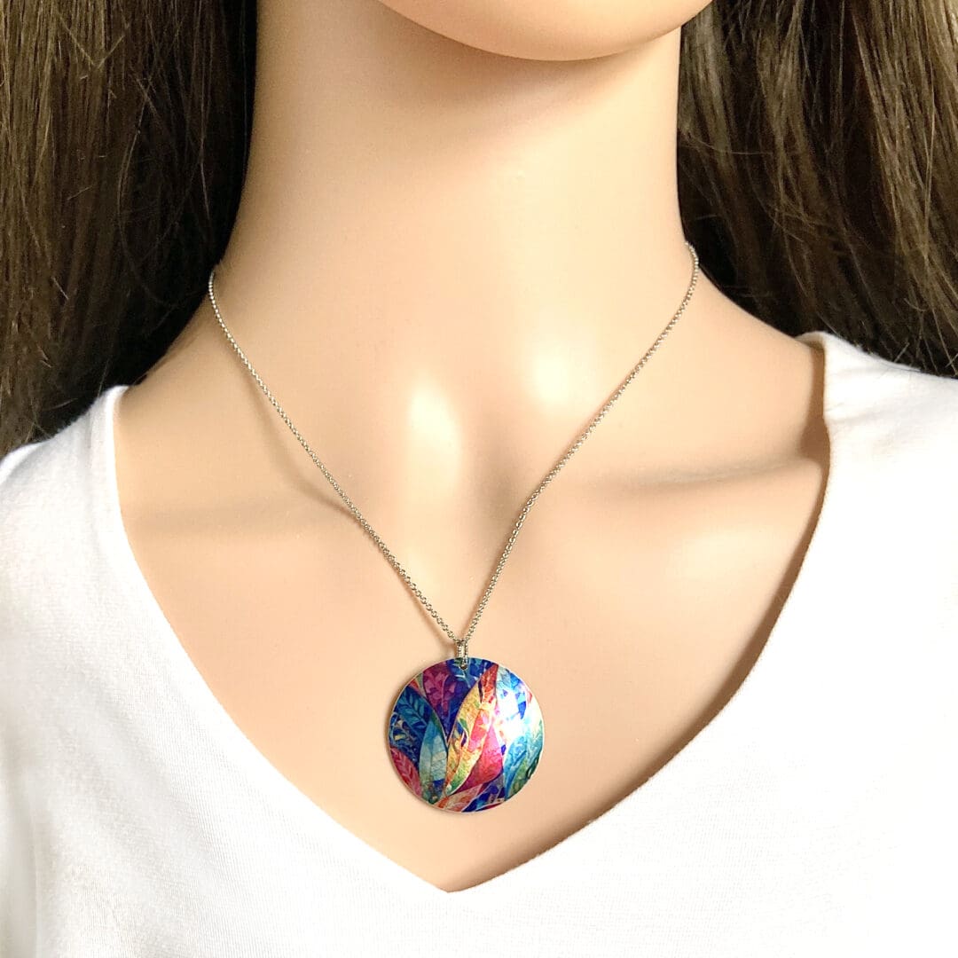 Necklace, pendant, jewellery, round, disc, metal, aluminium, multi-coloured, rainbow, leaf, nature, handmade, recycled, made in uk