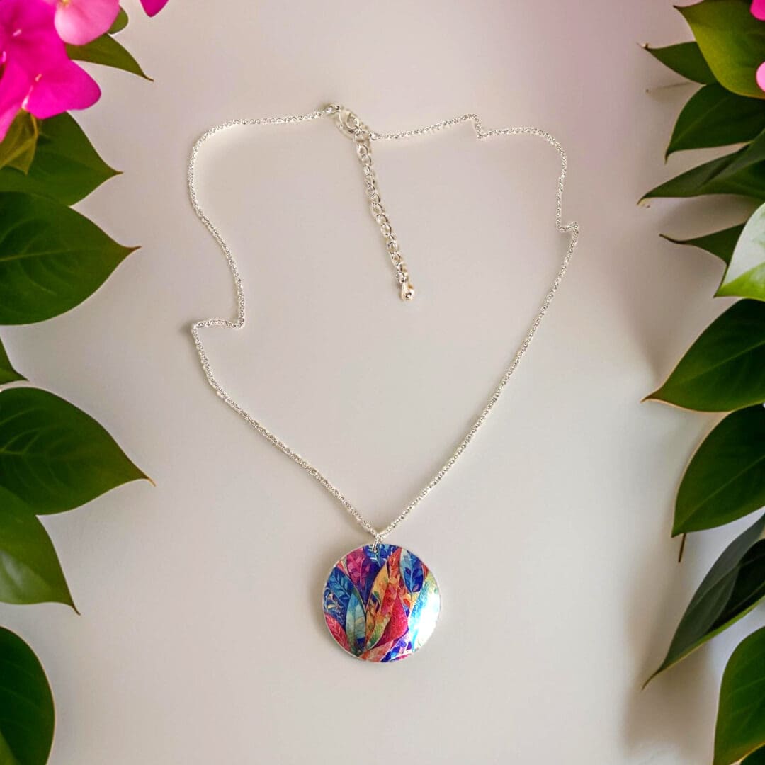 Necklace, pendant, jewellery, round, disc, metal, aluminium, multi-coloured, rainbow, leaf, nature, handmade, recycled, made in uk